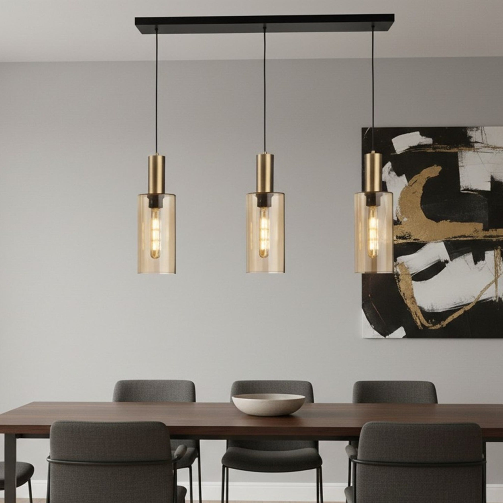 Arden Smoked Amber Glass 3 Light Bar Pendant hanging above a dining table in a modern room