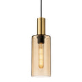 Arden Smoked Amber Glass Pendant in satin brass, straight-on view with the filament bulb lit inside the amber glass cylinder