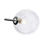 Close-up of the swirled clear glass globe and chrome arm on the Ashby Semi-Flush Ceiling Light