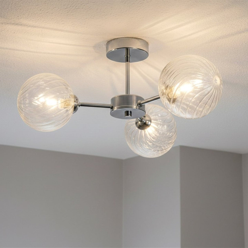 Ashby Swirled Glass 3 Light Semi-Flush Ceiling Light in chrome, lit and fitted to a ceiling
