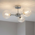 Ashby Swirled Glass 3 Light Semi-Flush Ceiling Light in chrome, lit and fitted to a ceiling