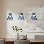 Bexley 3 Light Bar Pendant in blue glass hung over a dining table