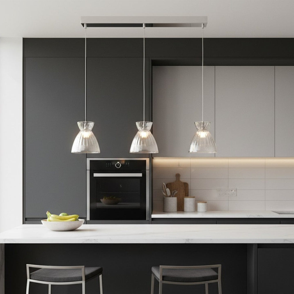Bexley 3 Light Bar Pendant in clear glass hung over a kitchen island