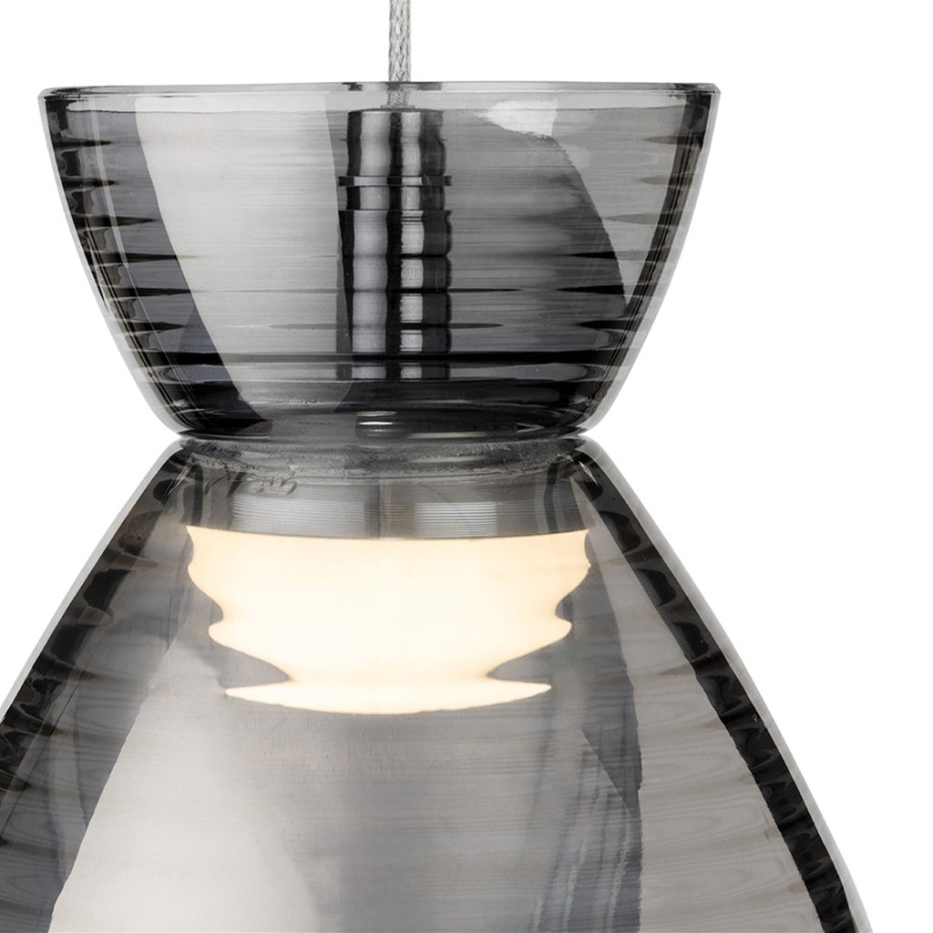 Close detail of the two-part smoked ribbed glass shade and chrome fitting