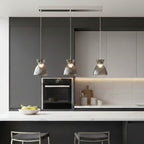 Bexley 3 Light Bar Pendant in smoked glass hung over a kitchen island