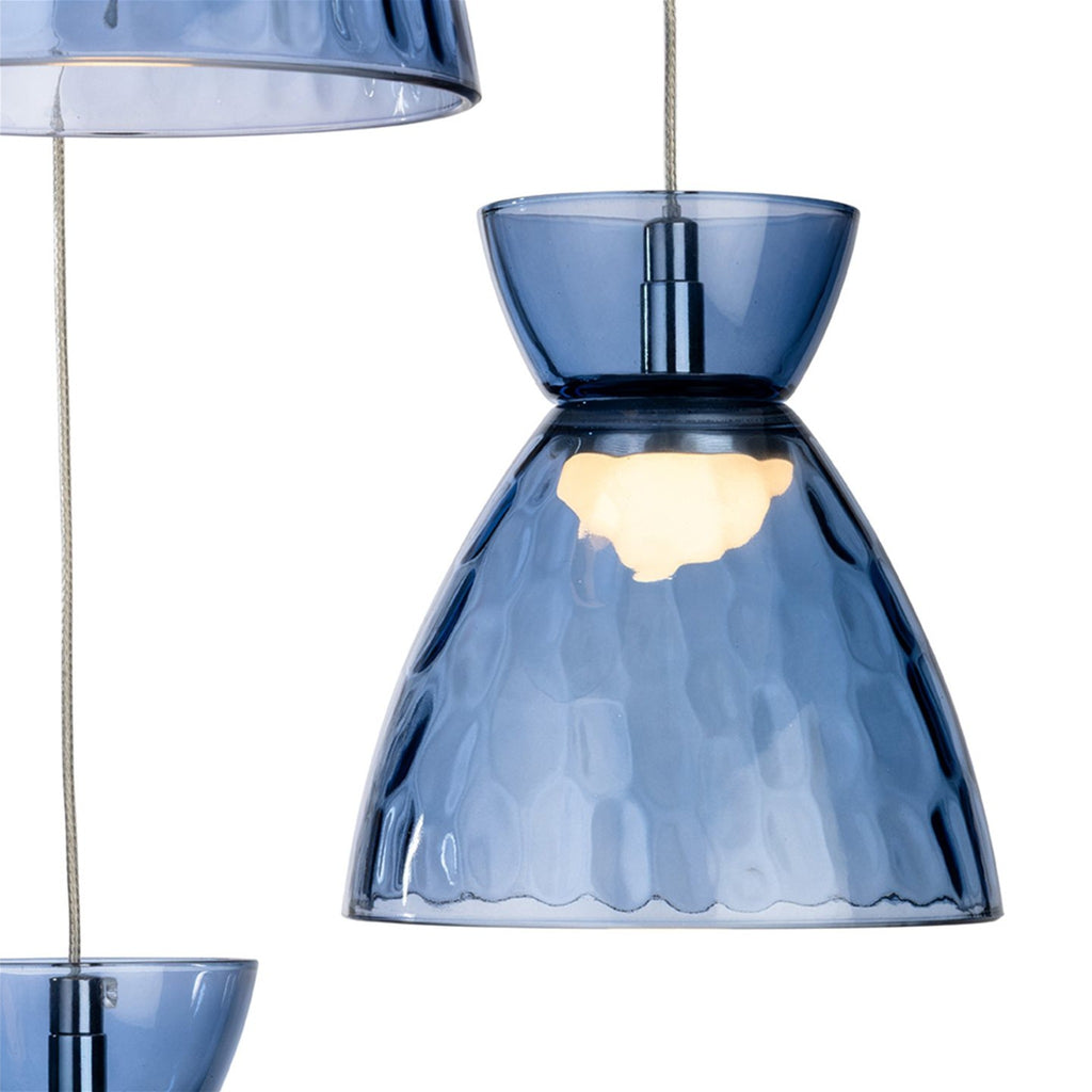 Blue dimpled glass shade of the Bexley 3 Light Cluster Pendant, lit