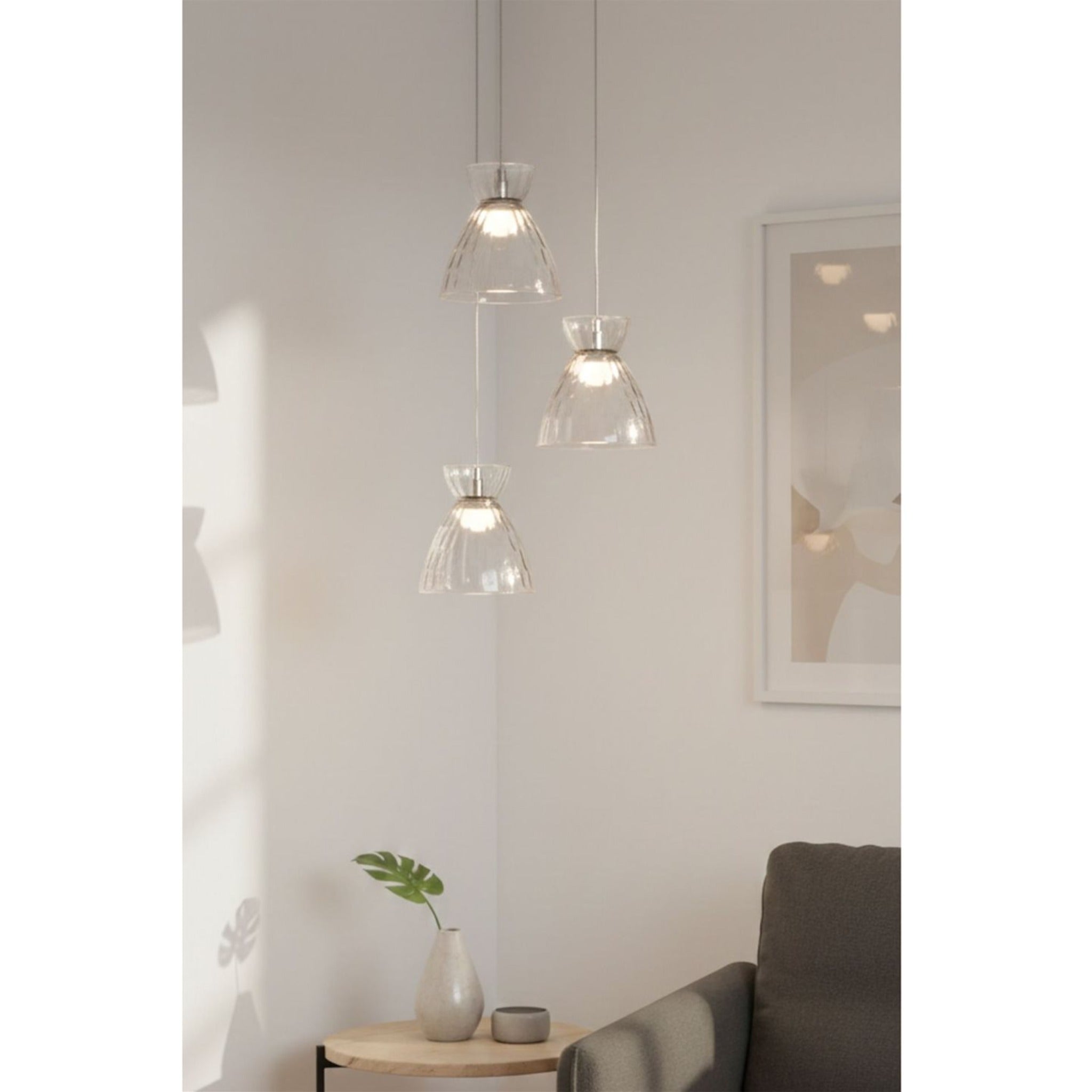Bexley 3 Light Cluster Pendant in clear glass hung in a living room corner