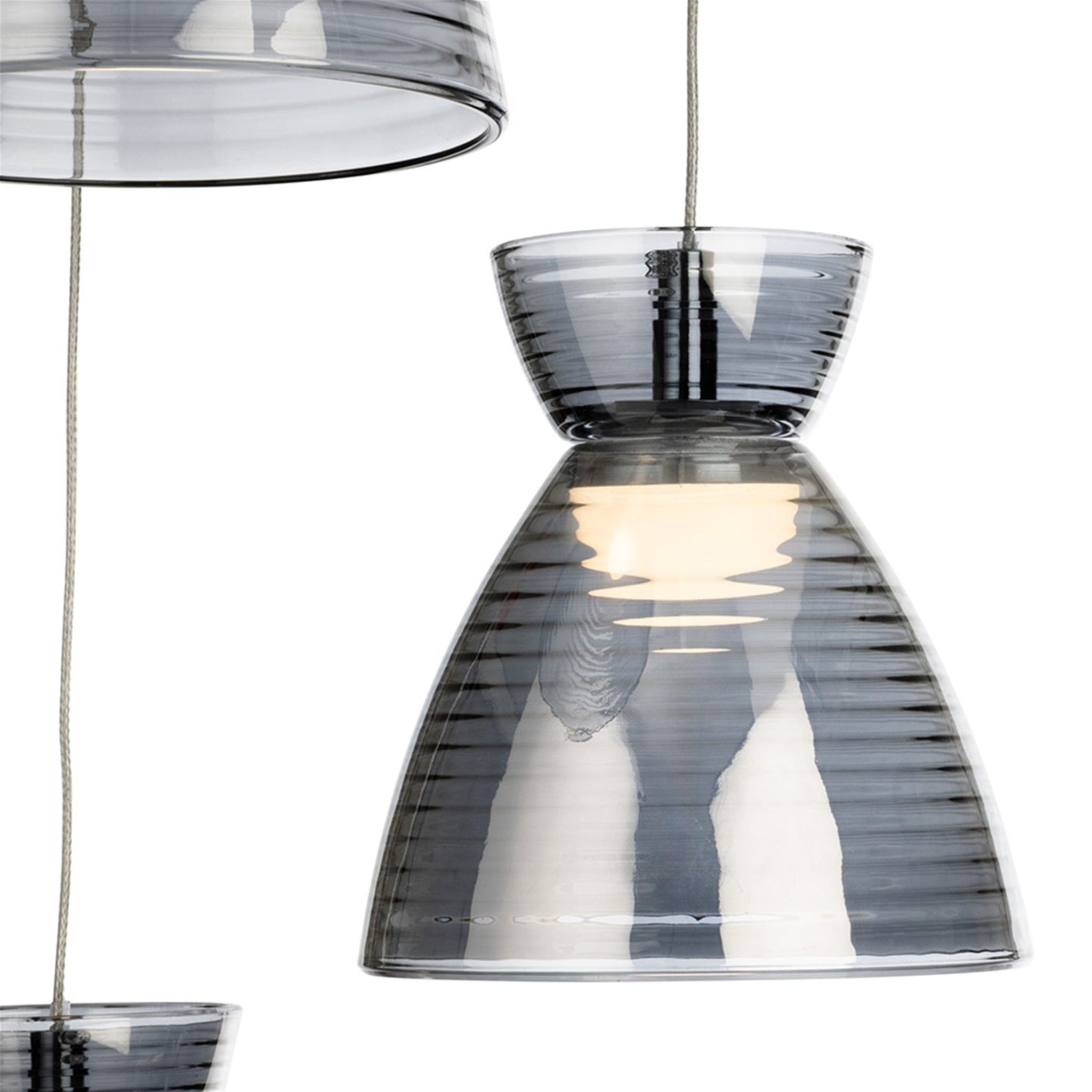 Smoked ribbed glass shade of the Bexley 3 Light Cluster Pendant, lit