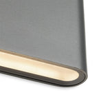 Close-up of the lit lower edge of the Brecon Slim LED Up & Down Wall Light in graphite
