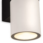 Close-up detail of the Denby Slim Up & Down Wall Light in white, showing the lit lower cylinder