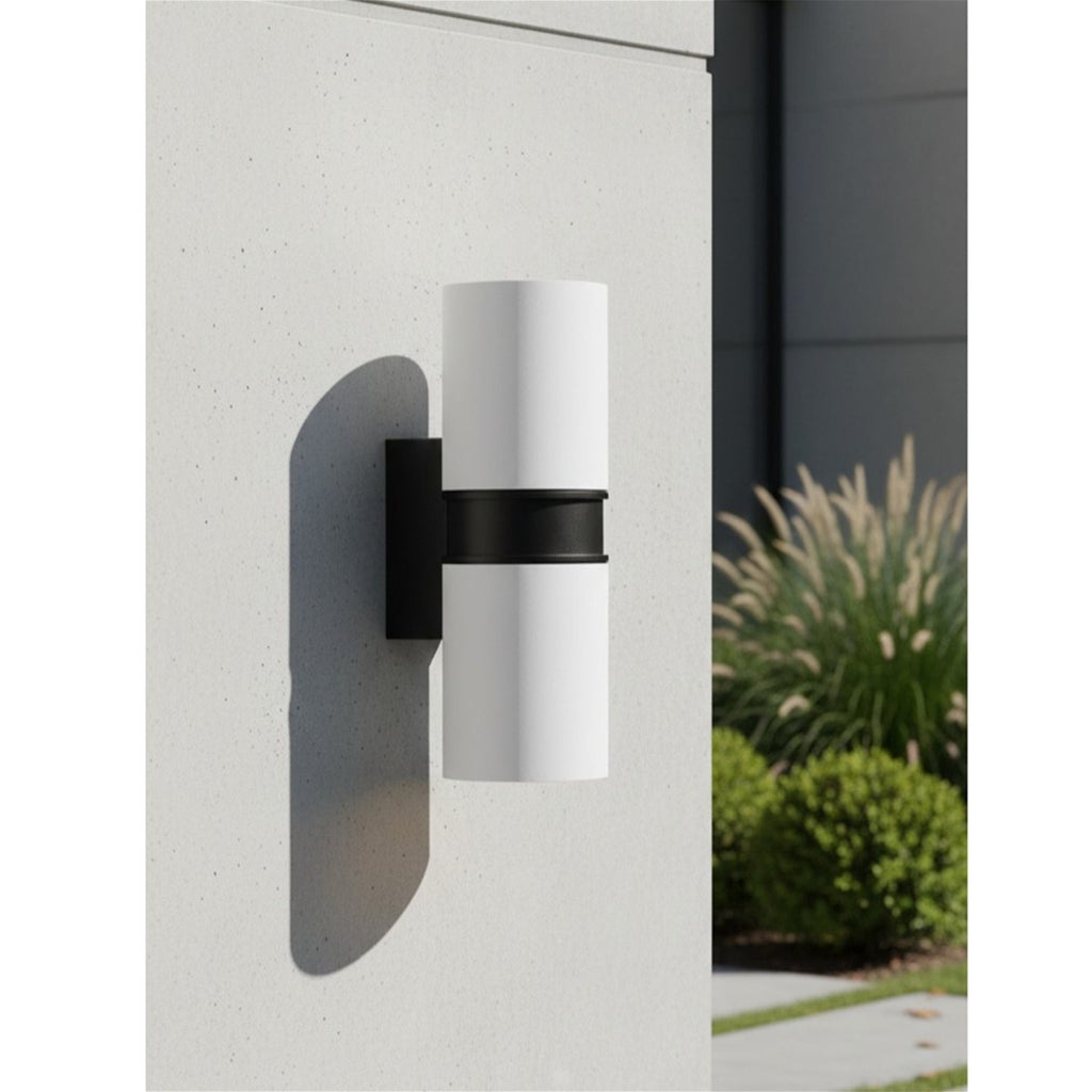 Denby Slim Up & Down Wall Light in white mounted on a rendered garden wall