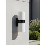 Denby Slim Up & Down Wall Light in white mounted on a rendered garden wall