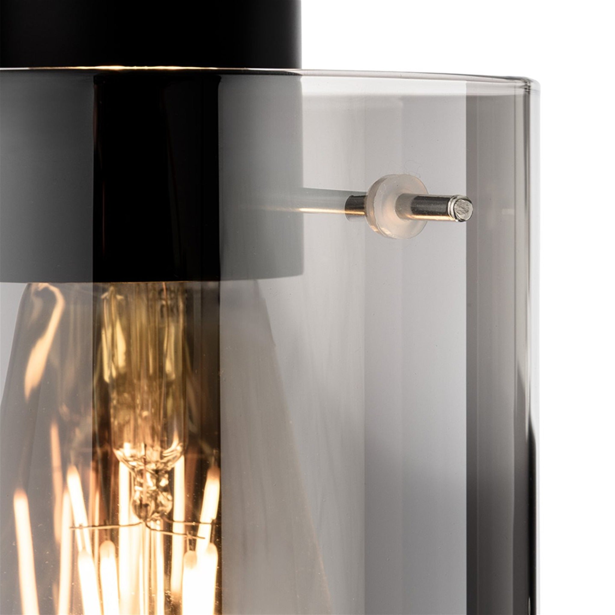 Close-up of the Elden Smoked Glass Pendant's black fitting and glass shade