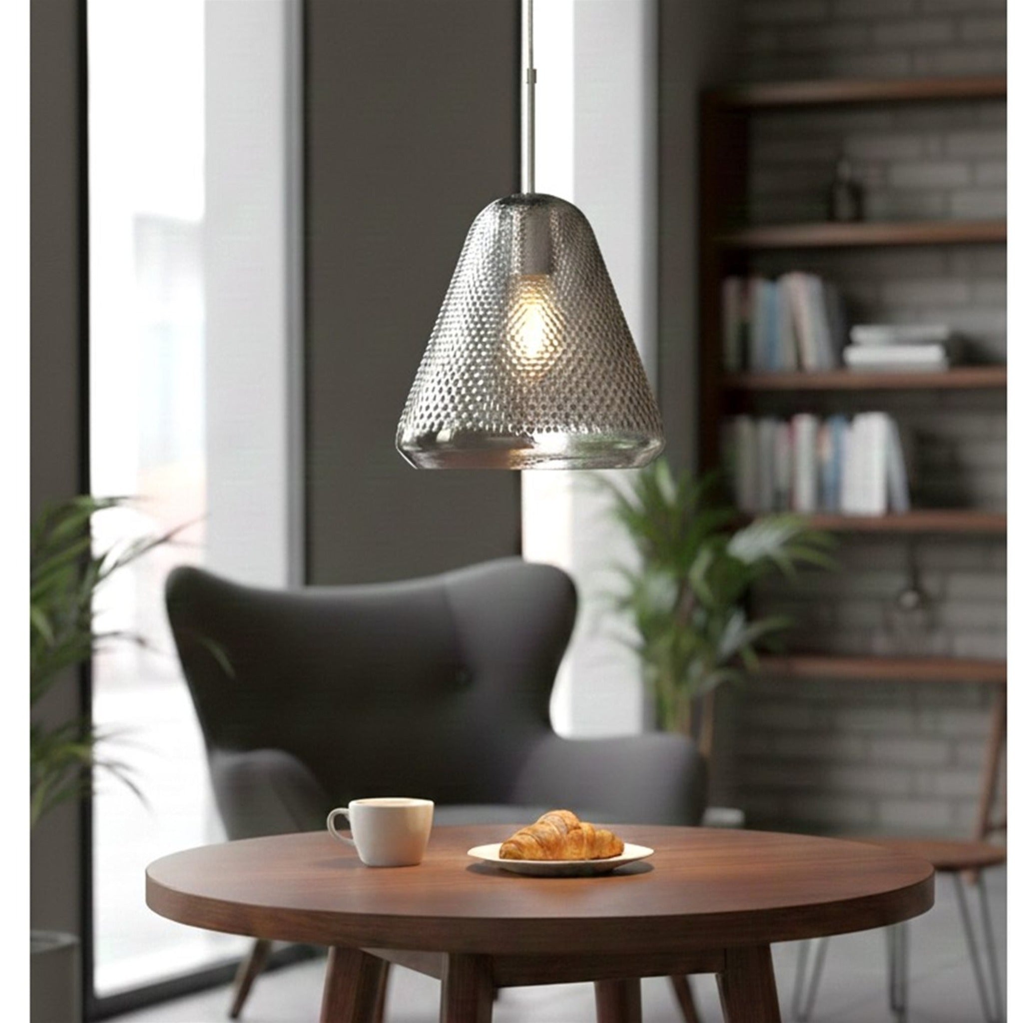 Elin Dimpled Glass Pendant in smoked glass hanging above a round table in a living room
