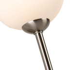 Ellis Globe Wall Light in brushed steel, close-up of the opal white glass globe and stem fixing
