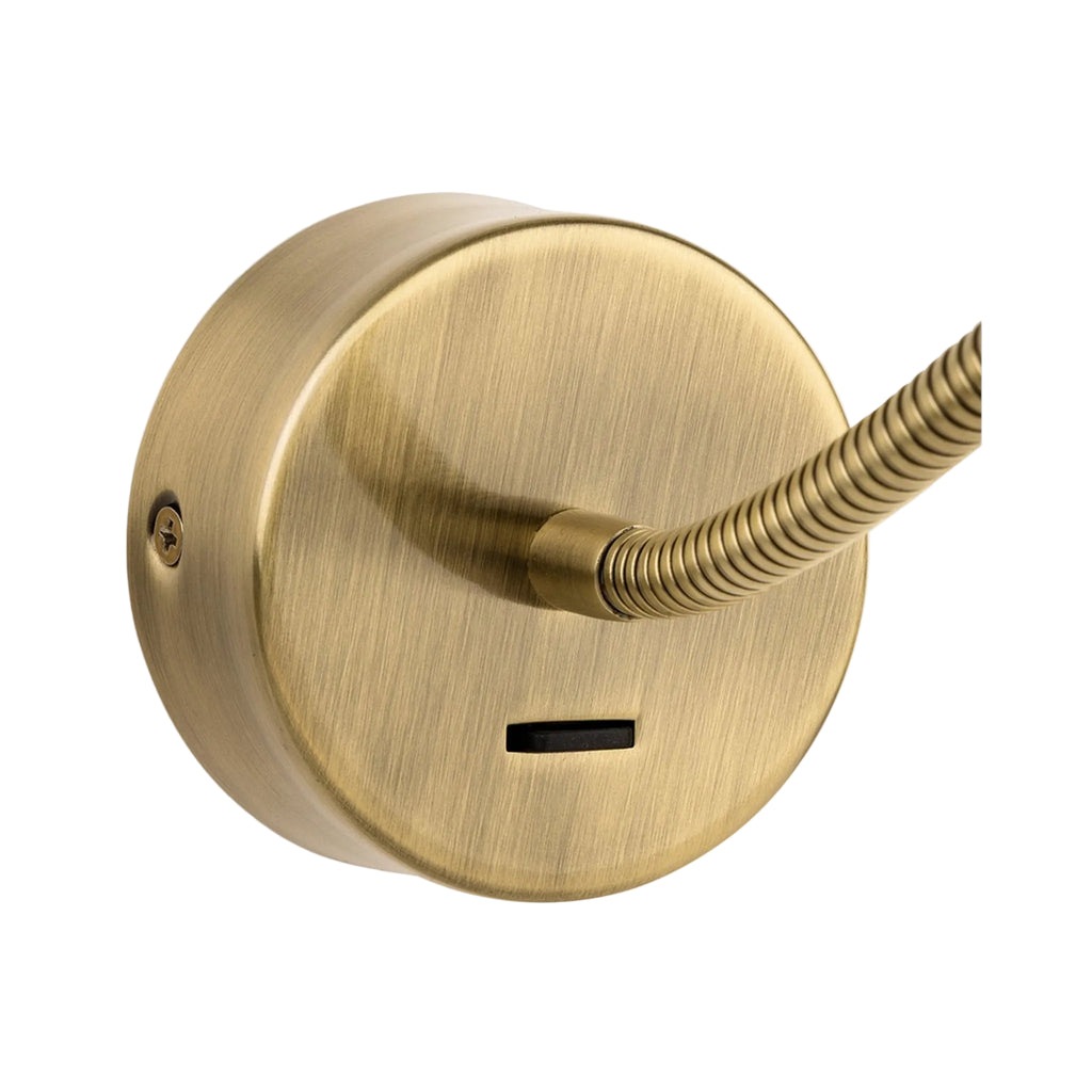 Elsie Flexible Arm LED Reading Wall Light in antique brass, close view of the round backplate and rocker switch