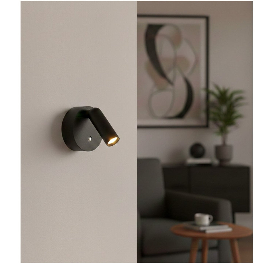 Kelby Magnetic Rechargeable LED Spotlight in black, mounted on a living room wall