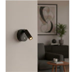 Kelby Magnetic Rechargeable LED Spotlight in black, mounted on a living room wall