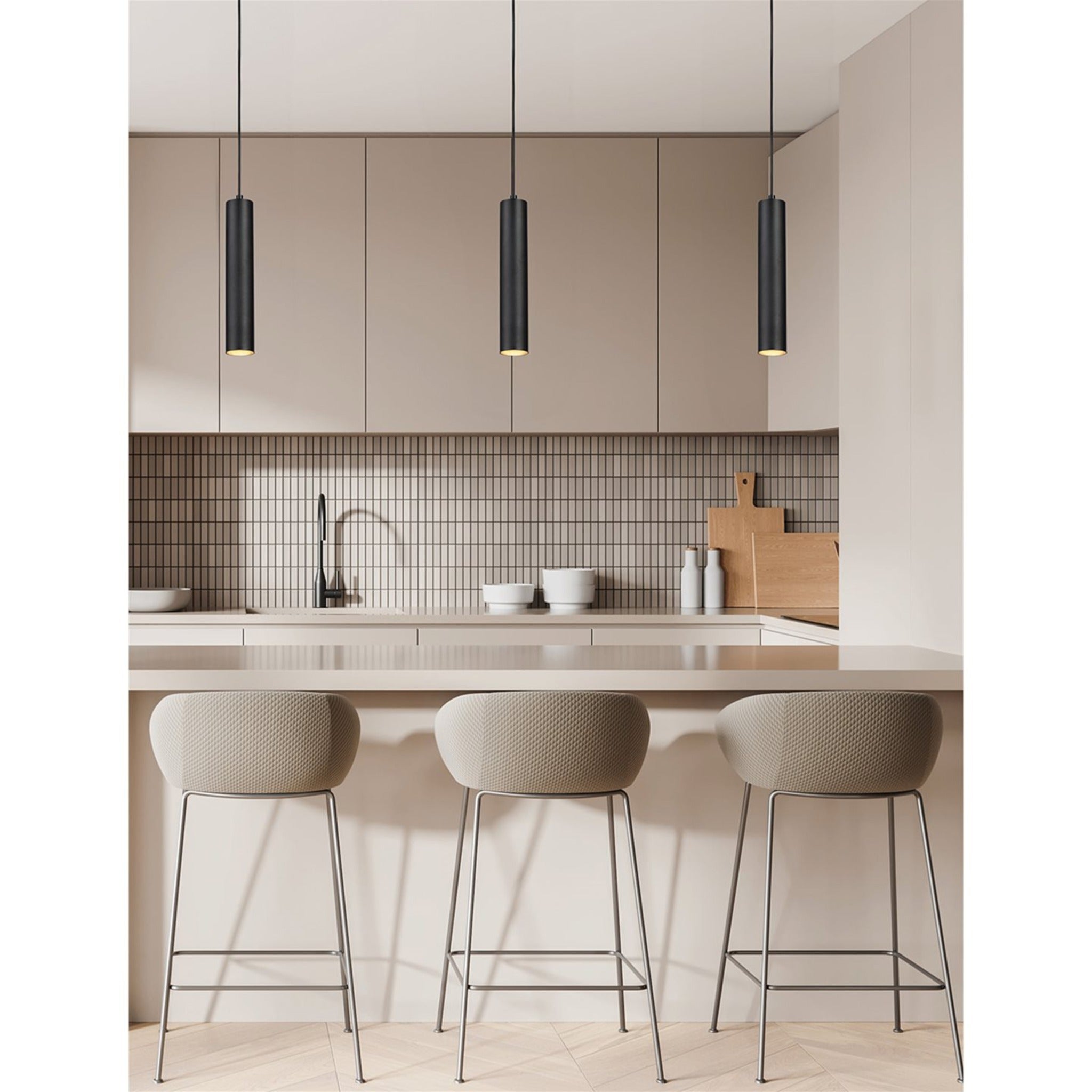 Black Kelso pendants hanging over a kitchen island with bar stools