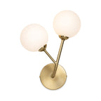Lyra Twin Globe Wall Light in brushed brass, angled view showing the round backplate