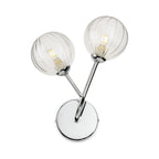 Lyra Twin Globe Wall Light in chrome, angled view showing the round backplate