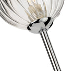 Close-up of the ribbed clear glass globe and chrome arm on the Lyra Twin Globe Wall Light