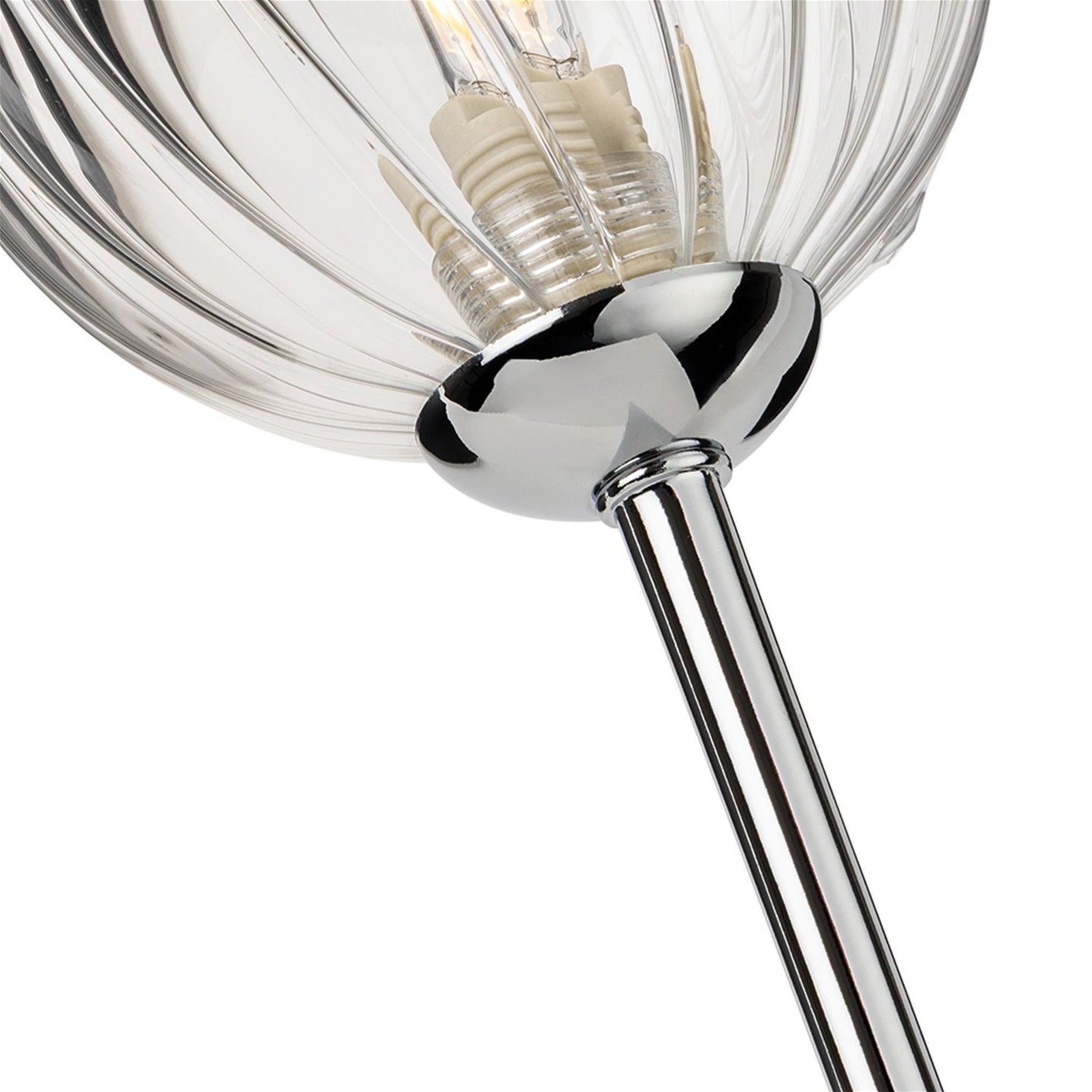 Close-up of the ribbed clear glass globe and chrome arm on the Lyra Twin Globe Wall Light