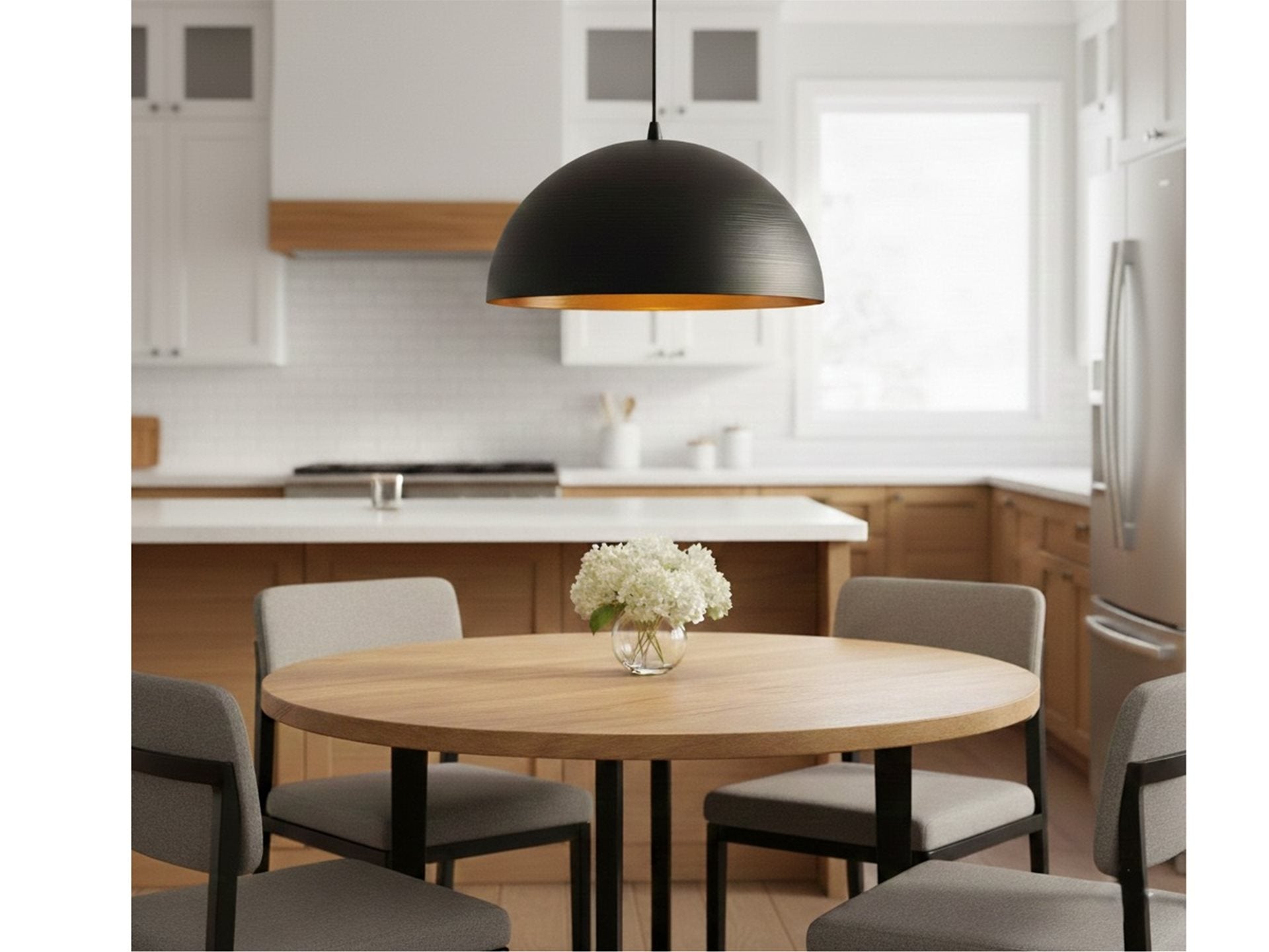Maren Gold-Lined Dome Pendant in matt black hanging above a kitchen dining table