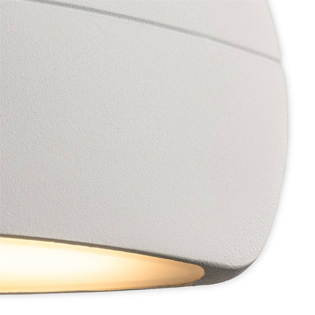 Close-up of the textured white finish and downward light output