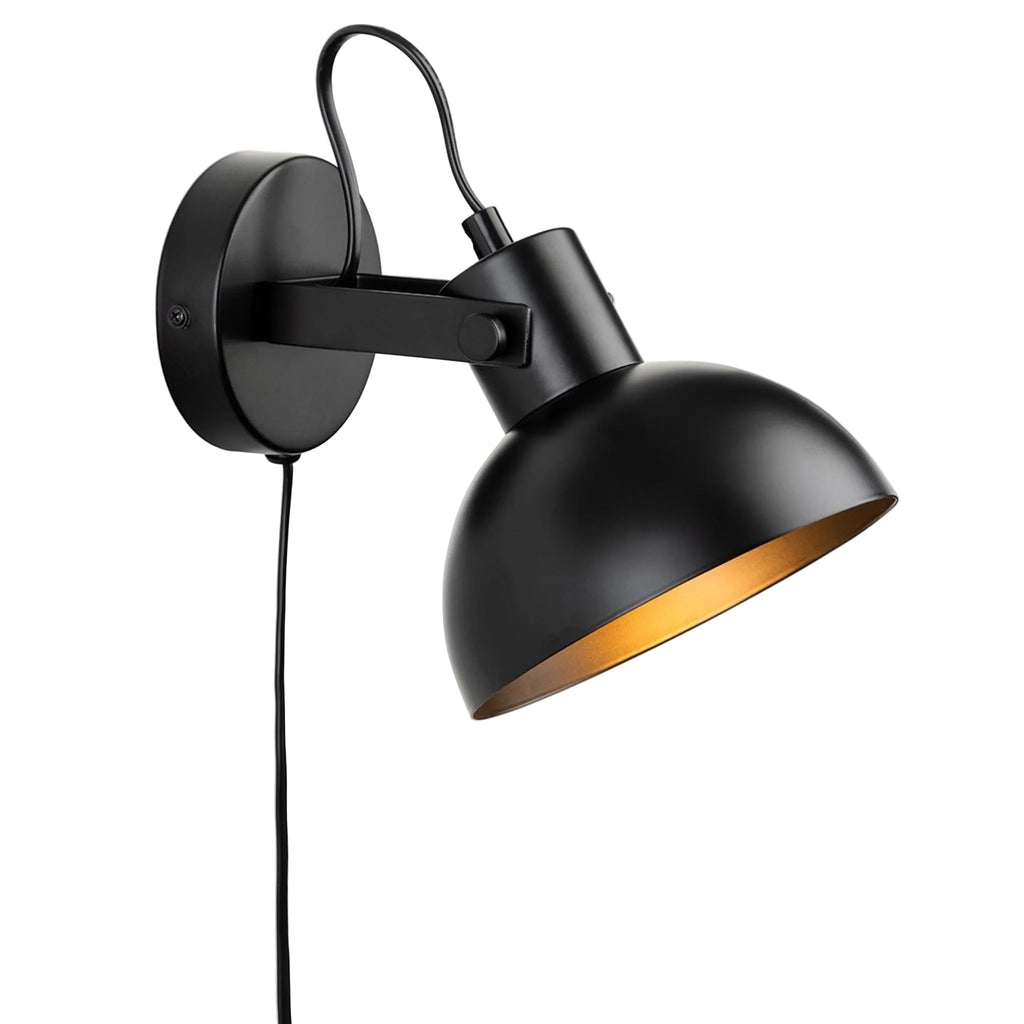 Nyla Plug-In Dome Wall Light in black, angled view showing the tilting dome shade and brass-toned interior