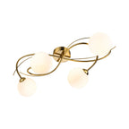 Orla Swirl Globe 4 Light Flush Ceiling Light in brushed brass with opal white glass globes, angled view