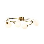 Orla Swirl Globe 4 Light Flush Ceiling Light in brushed brass, side view showing the shallow 18cm drop