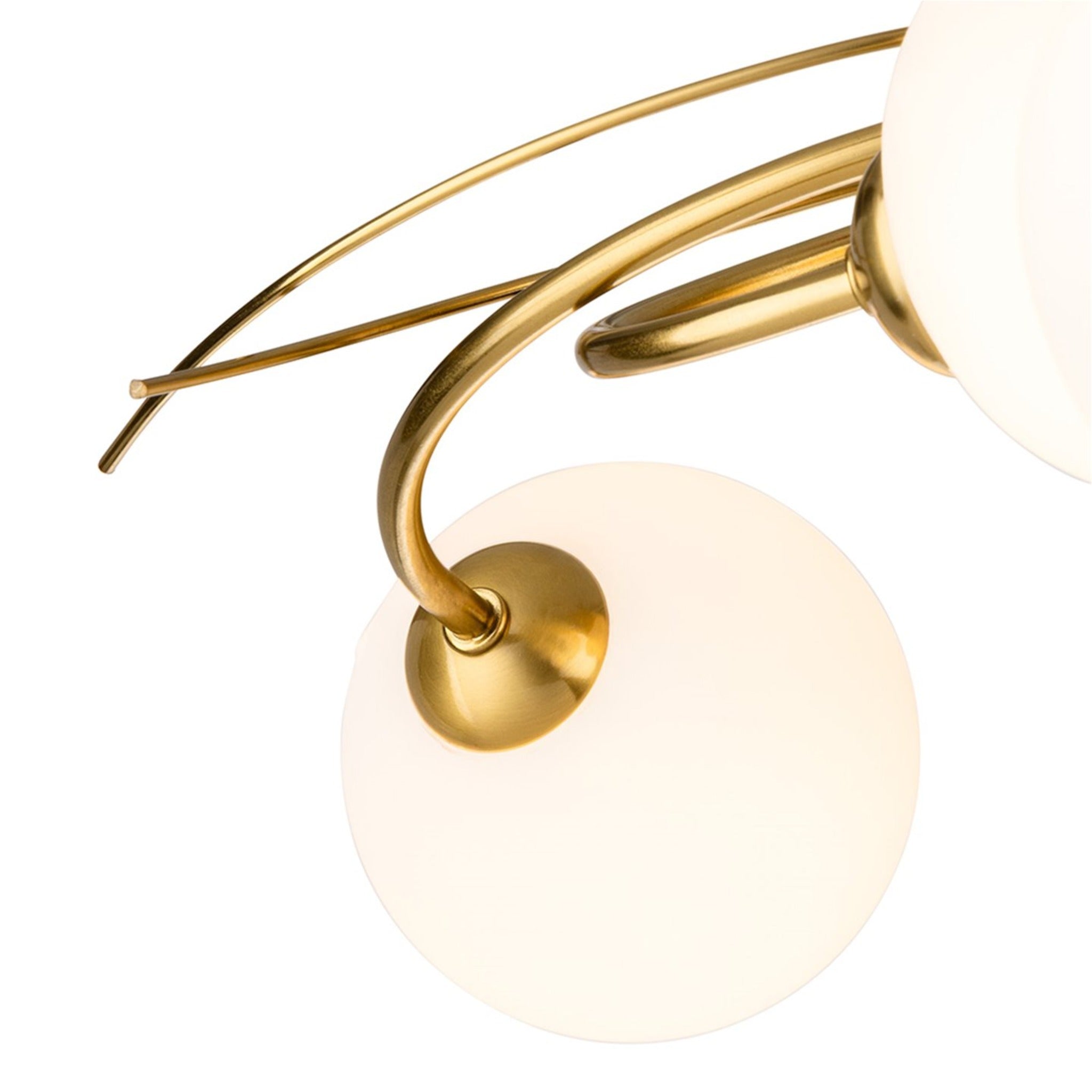 Detail of the brushed brass arms and opal white glass globes