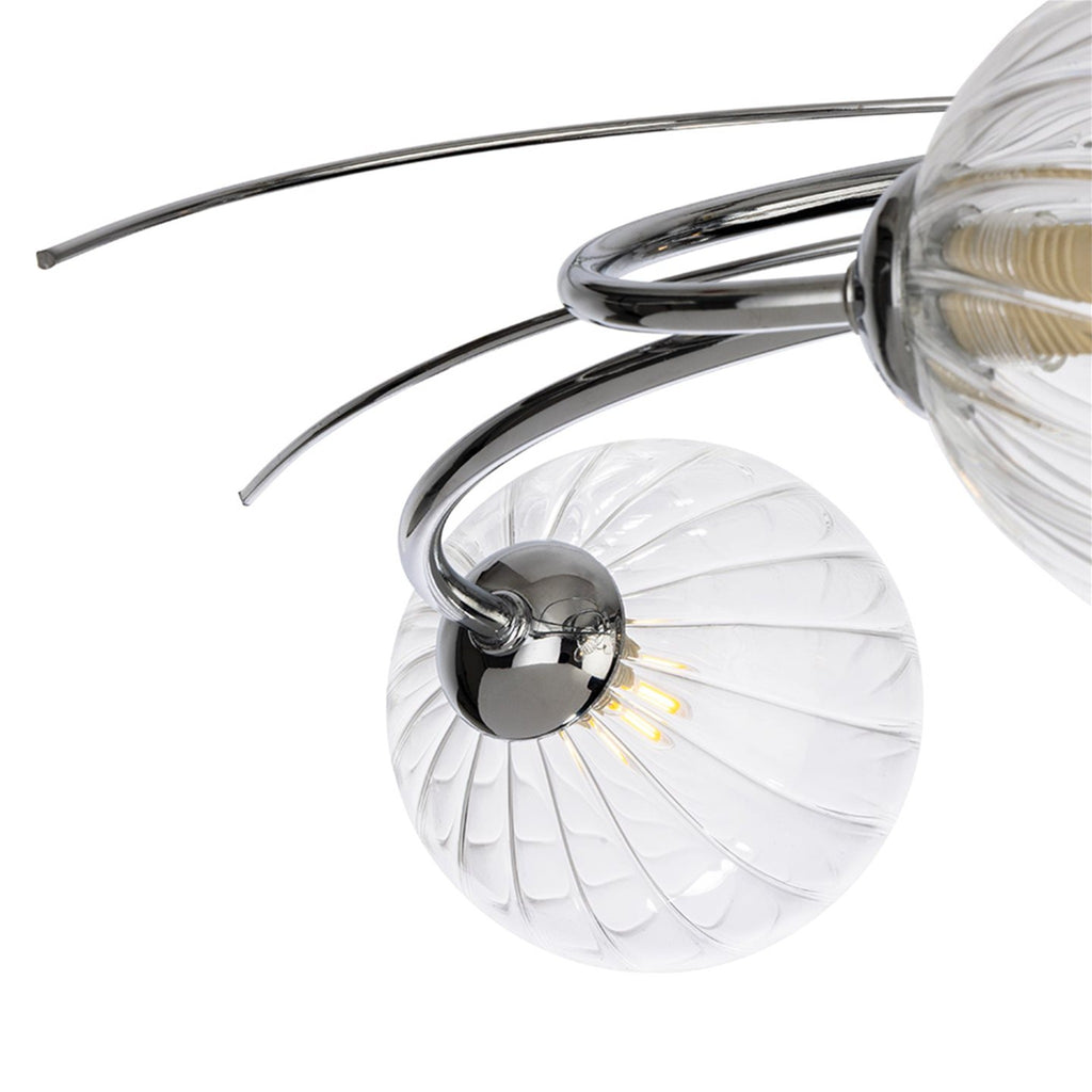 Detail of the chrome arms and clear ribbed glass globes