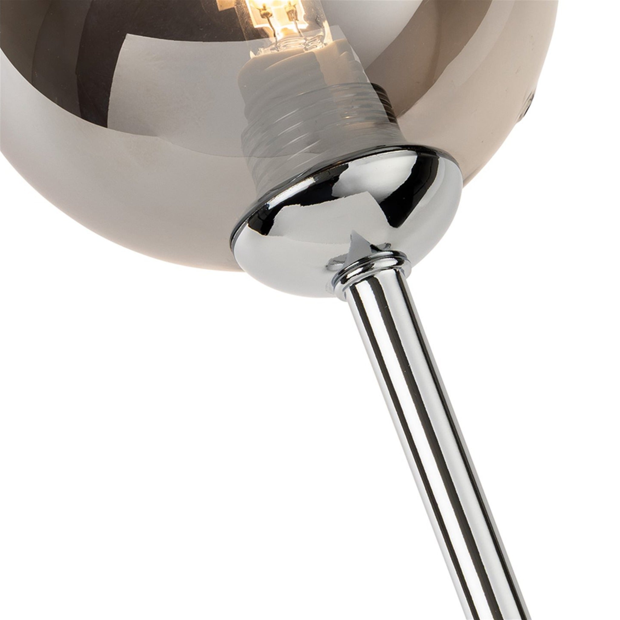 Close-up of the smoked glass shade and fluted chrome stem