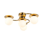Thea 4 Light Opal Globe Flush Ceiling Light in brushed brass, side view showing the curved arms