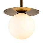 Close detail of the Thea Opal Globe Pendant, brushed brass plate meeting the opal glass globe