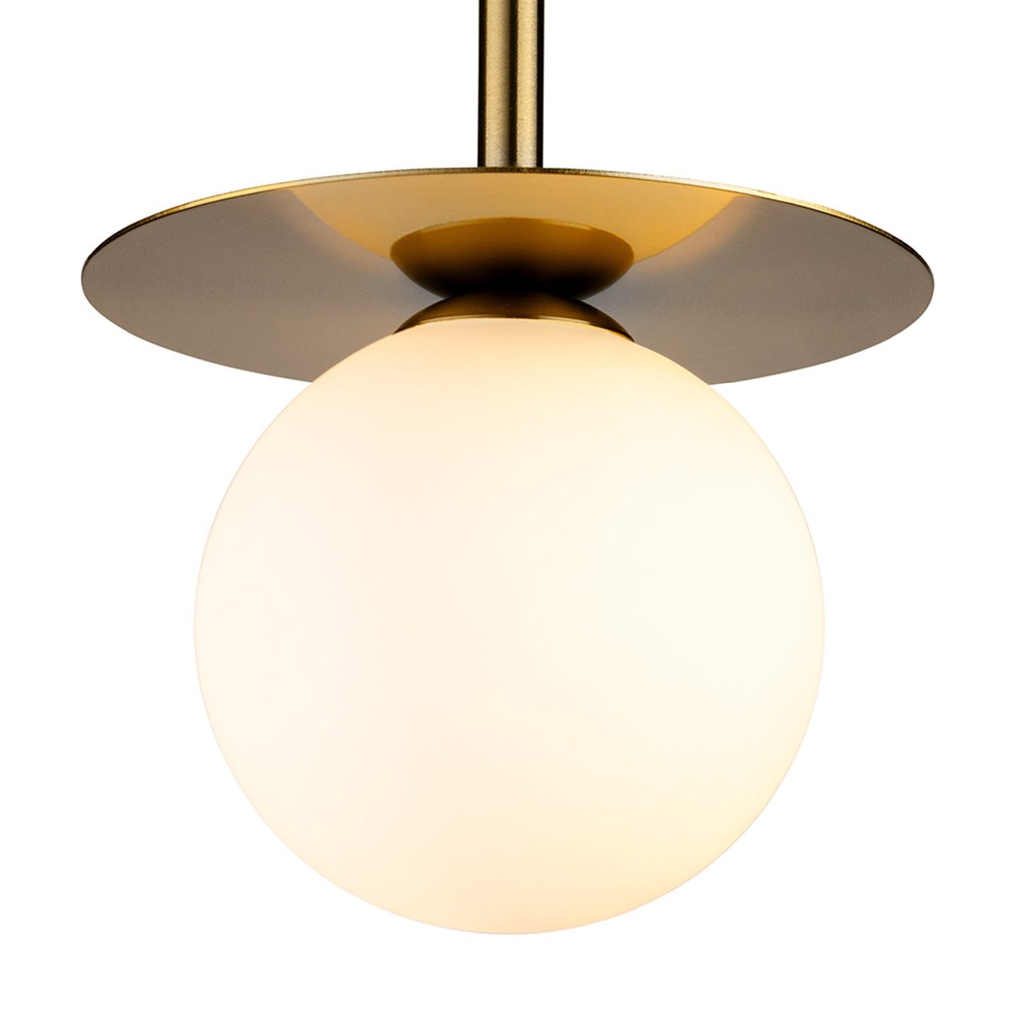 Close detail of the Thea Opal Globe Pendant, brushed brass plate meeting the opal glass globe