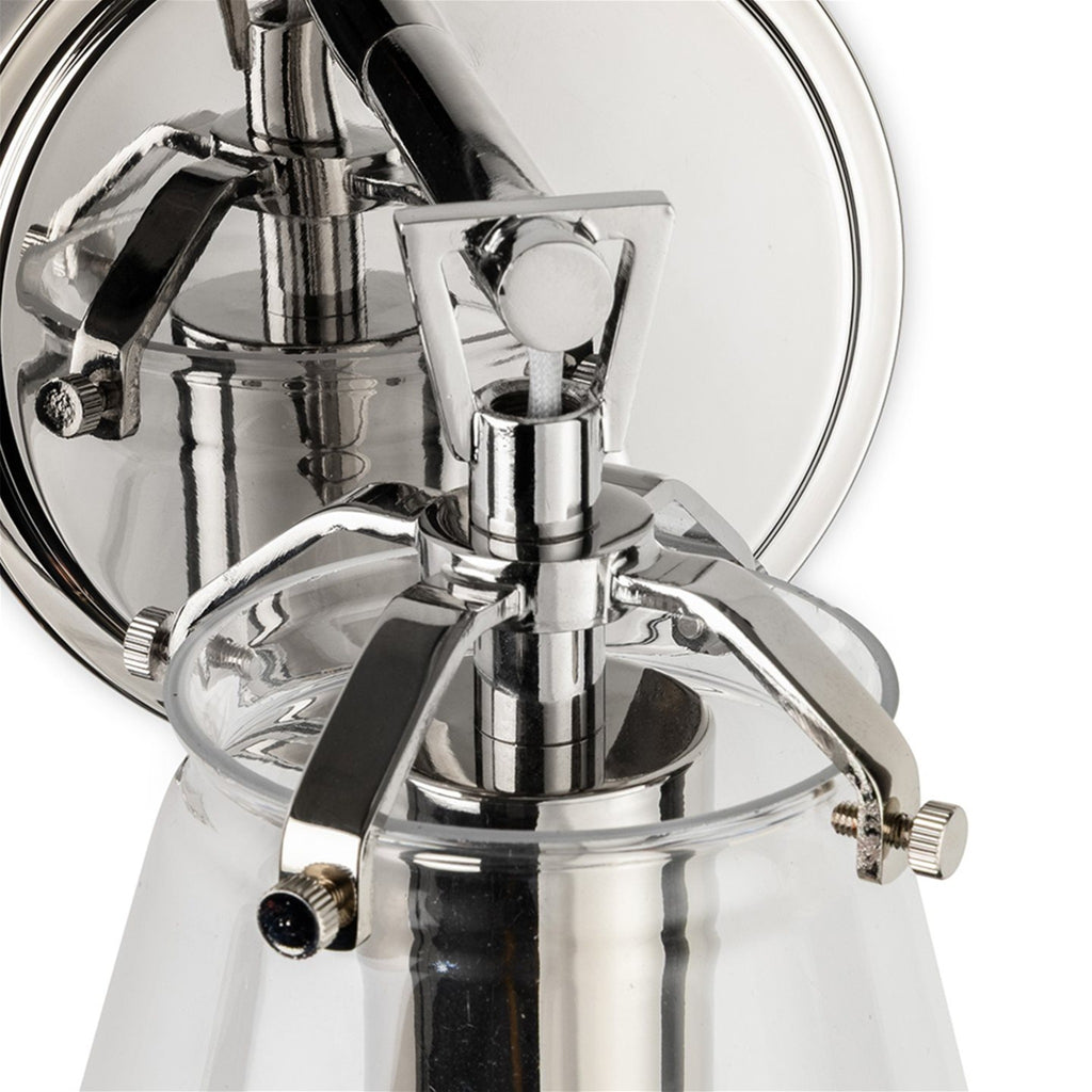 Vela Tapered Clear Glass Wall Light in chrome, close-up of the chrome bracket and wall plate